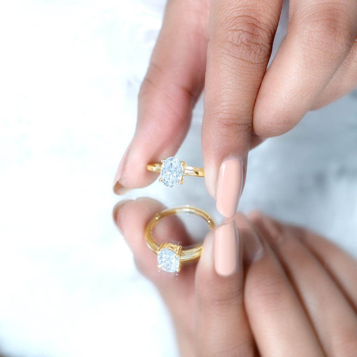 Certified 6x8mm oval moissanite solitaire engagement ring by Rosec Jewels, showcasing a sparkling center stone and elegant band.