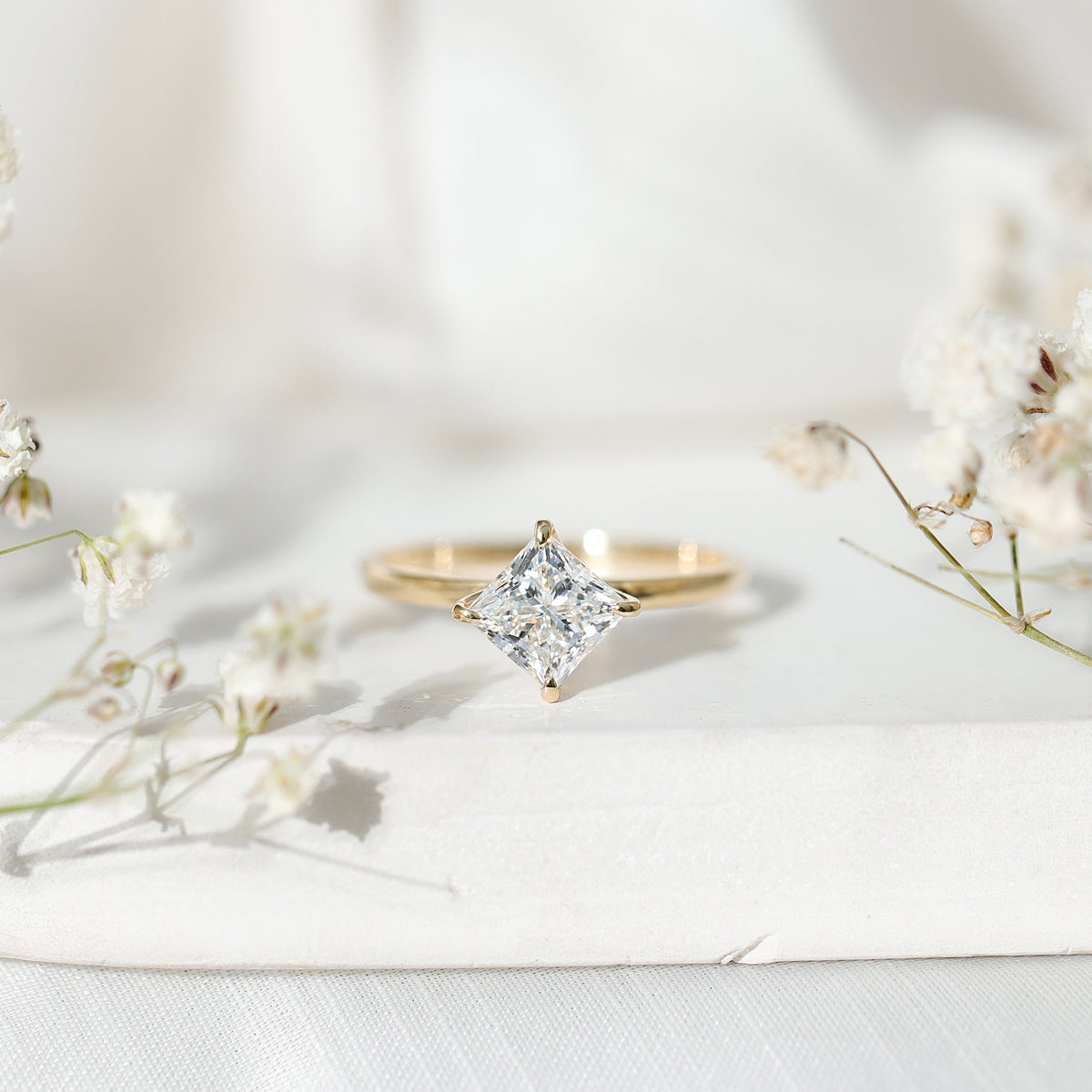 Lab grown 1.25 CT princess cut diamond solitaire engagement ring by Rosec Jewels featuring a sleek band and sparkling center stone.
