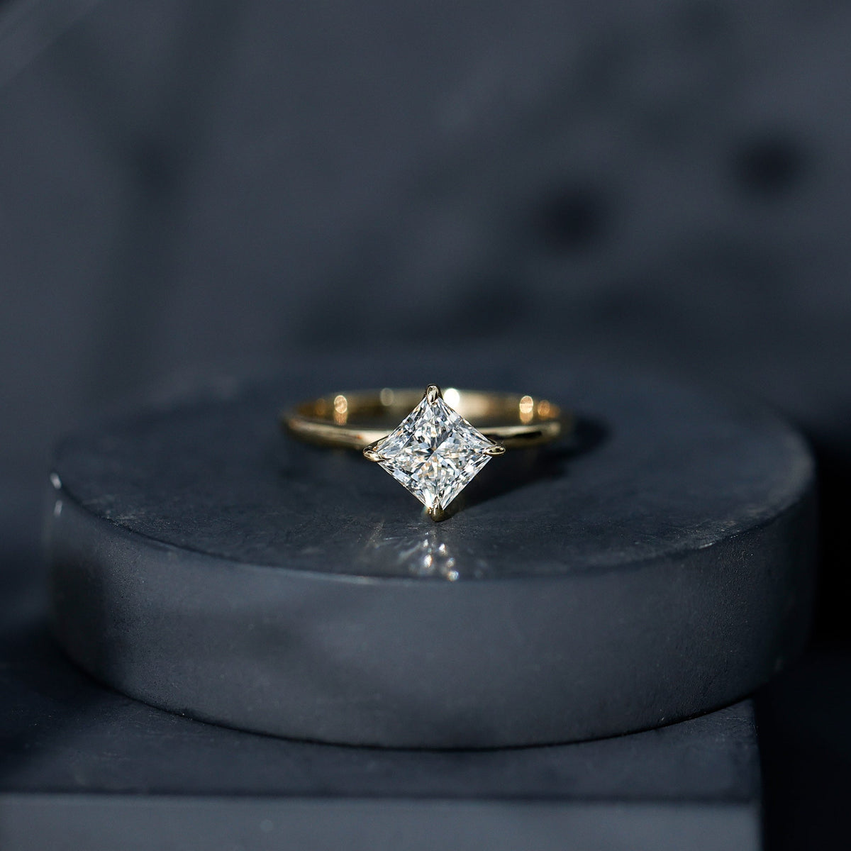 Princess cut lab grown diamond solitaire engagement ring in 1.25 carats with a sleek band from Rosec Jewels.