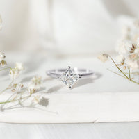 Rosec Jewels 1.25 CT princess cut lab-grown diamond solitaire engagement ring showing a sparkling square diamond on a sleek band.