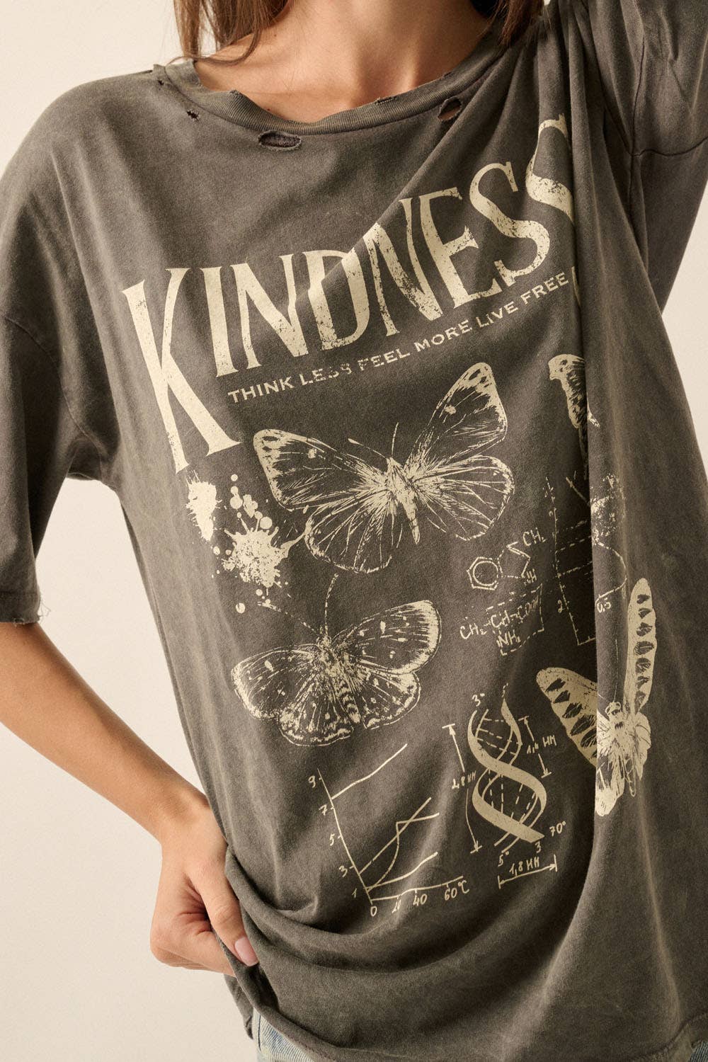 Rosie Karma blonde butterfly t-shirt showing a casual shirt with a butterfly graphic on a light-colored fabric.