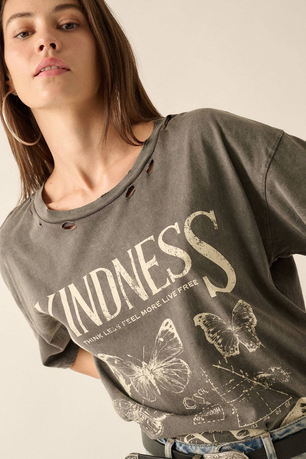 Blonde Butterfly Tee by Rosie Karma, casual shirt featuring a butterfly graphic on soft fabric, displayed on a hanger.
