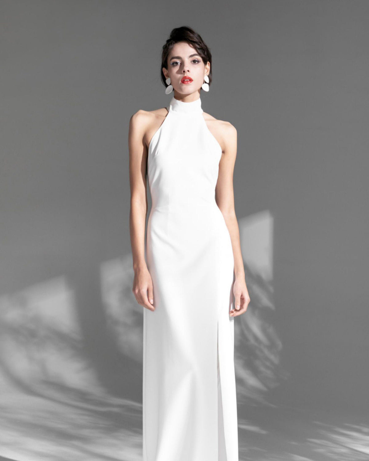 Elegant satin mini wedding dress with halter neckline, open back, thigh split, designed by SelenaHuanStudio.