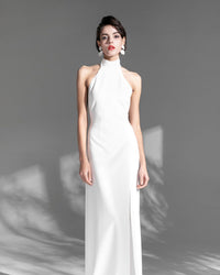 Elegant satin mini wedding dress with halter neckline, open back, thigh split, designed by SelenaHuanStudio.