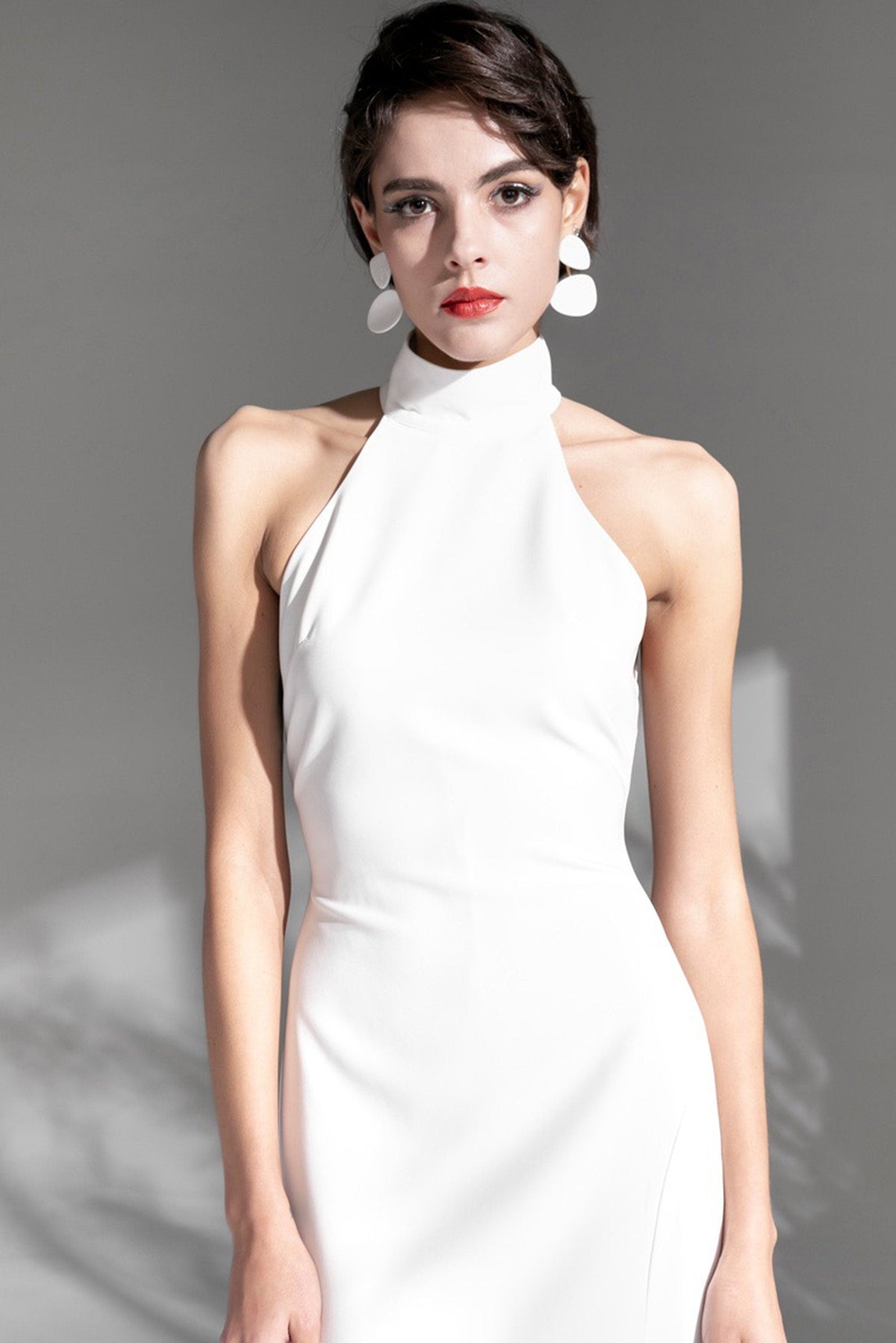 Elegant satin mini wedding dress with halter neckline, hollow back, thigh split, designed by SelenaHuanStudio.