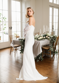 Silky satin mini wedding dress by SelenaHuanStudio featuring a strapless front button design, fit and flare silhouette, and a middle slit.