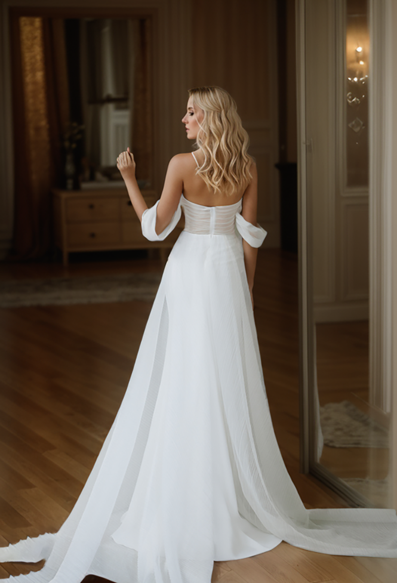 SelenaHuanStudio goddess off-the-shoulder satin wedding dress with small train and tulle ribbon for mini wedding occasions.