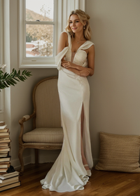 White satin Greece Goddess mini wedding dress with pleated bodice, wide straps, fit and flare silhouette, and thigh slit by SelenaHuanStudio.