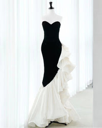 Black strapless sequin mermaid prom dress with ruffled organza by SelenaHuanStudio, featuring a fitted silhouette and elegant design.
