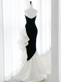 Black strapless sequin mermaid prom dress with ruffled organza accents by SelenaHuanStudio, showcasing a fitted silhouette and elegant design.