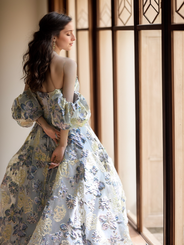 Elegant off-the-shoulder princess prom dress by SelenaHuanStudio with golden blue floral embroidery and flowing fabric.
