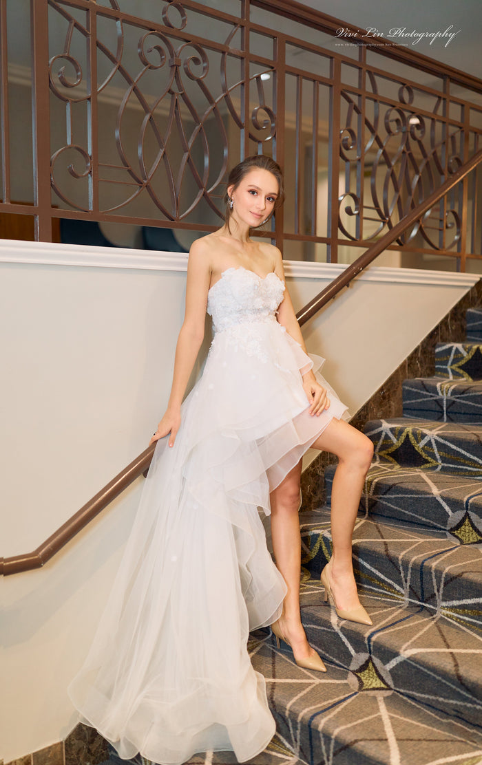 SelenaHuanStudio Musa strapless white wedding dress with 3D floral lace, short-long skirt, and detachable sleeves for prom.