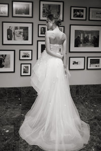 White strapless wedding dress with 3D floral lace, short on the front, long on the back, featuring detachable sleeves by SelenaHuanStudio.