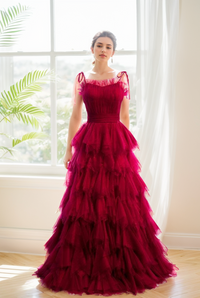 SelenaHuanStudio spaghetti-strap prom dress with pleated bodice, ruffle layers, and soft tulle tutu for elegant formal occasions.