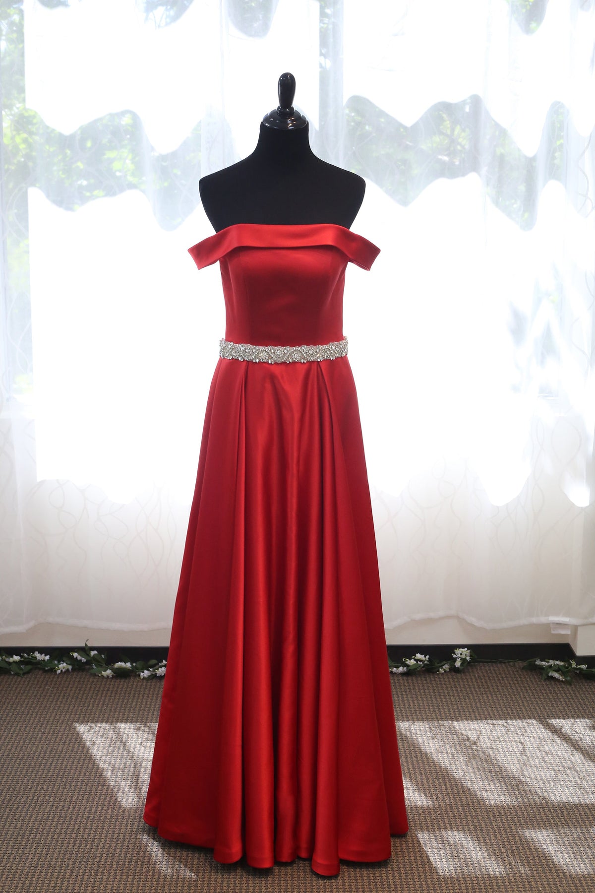 Off-shoulder ruby red satin prom dress with crystal beaded sash by SelenaHuanStudio, featuring an A-line silhouette and elegant design.