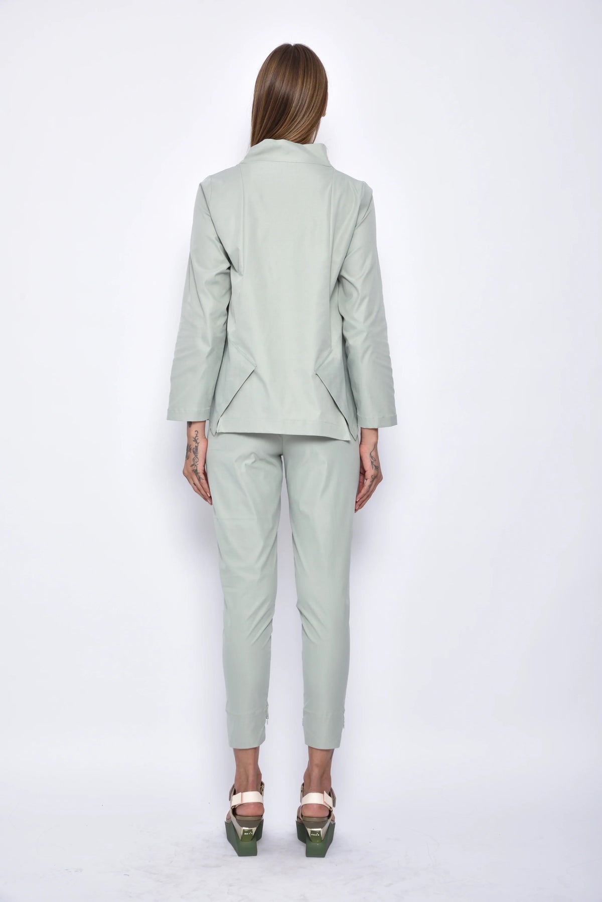 Back view of SIMPLY MILA Asia Pants, modern women's bottoms in sage green fabric with relaxed fit and stylish design.