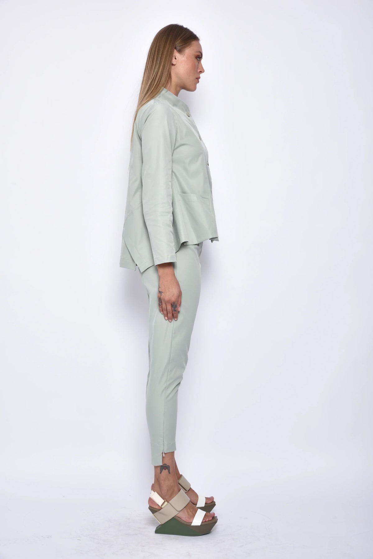 Side view of beige Asia pants by SIMPLY MILA Modern Women's Clothing, stylish bottoms with a relaxed fit and comfortable fabric.