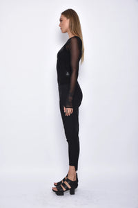 Black Asia Pants by SIMPLY MILA Modern Women's Clothing featuring a relaxed fit and side pockets, styled for casual wear.
