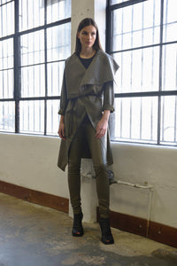 Simply Mila modern women's coat with an uneven hem, featuring a stylish, contemporary design in neutral fabric.