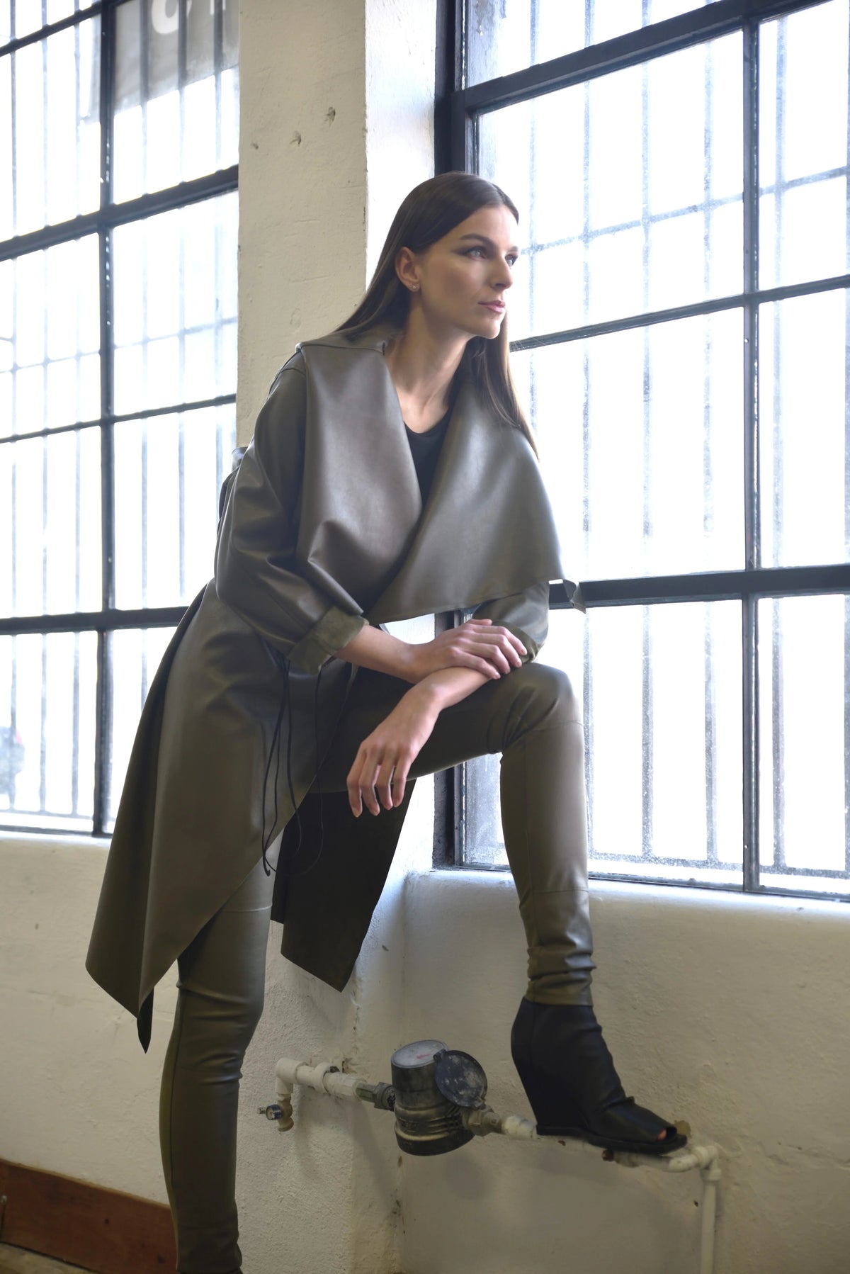 Simply Mila modern women's uneven coat with textured fabric and stylish design, shown on a model.
