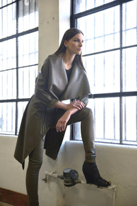 Simply Mila modern women's uneven coat with textured fabric and stylish design, shown on a model.