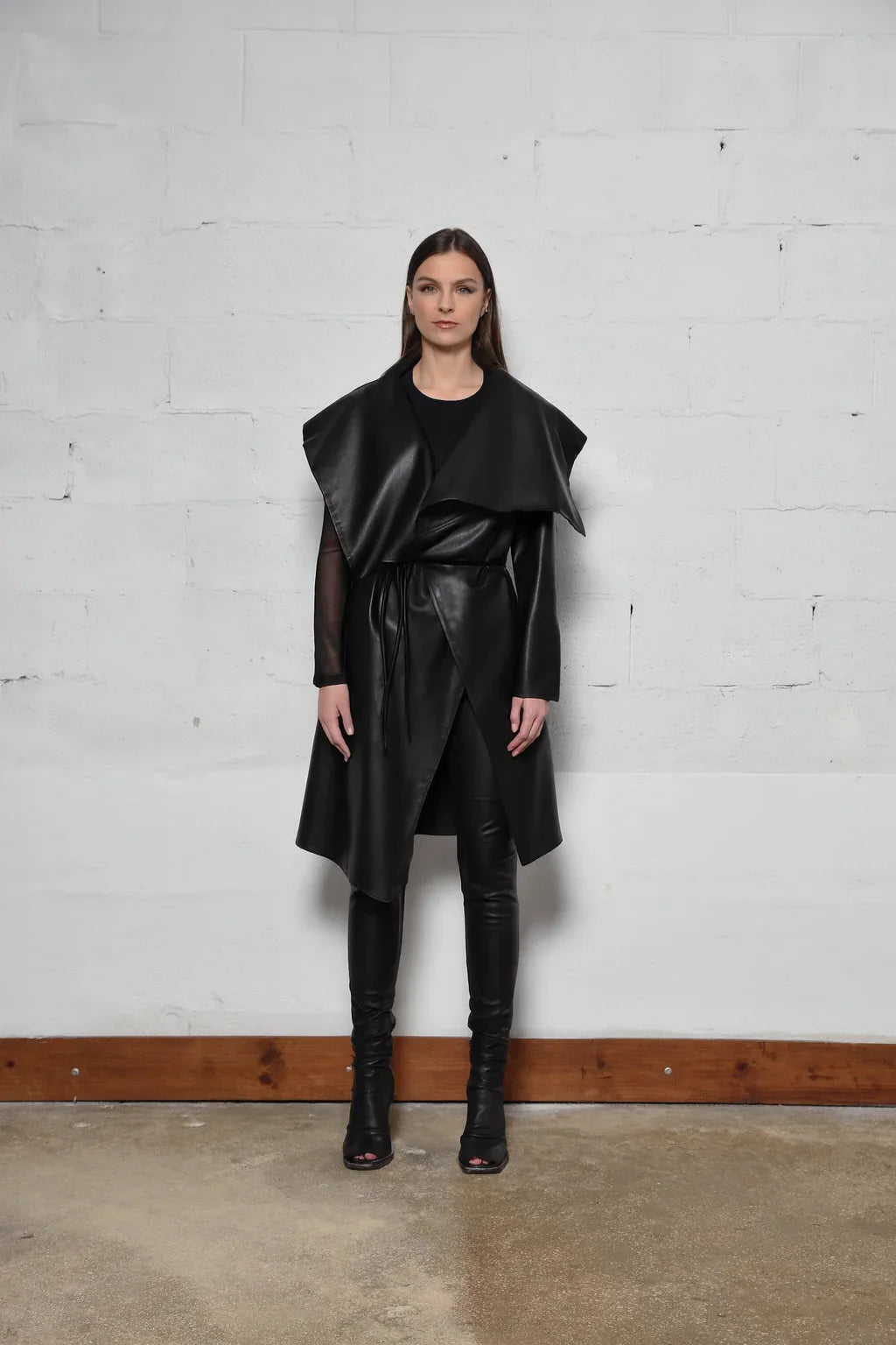 Uneven coat by SIMPLY MILA Modern Women's Clothing, featuring a stylish, asymmetrical design in neutral fabric.