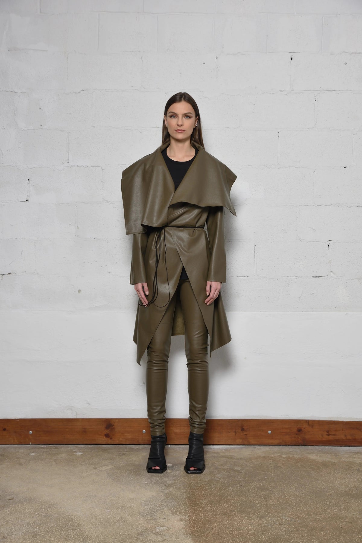 Simply Mila modern women's uneven coat shown in a stylish, textured design with a relaxed fit and unique asymmetrical hem.