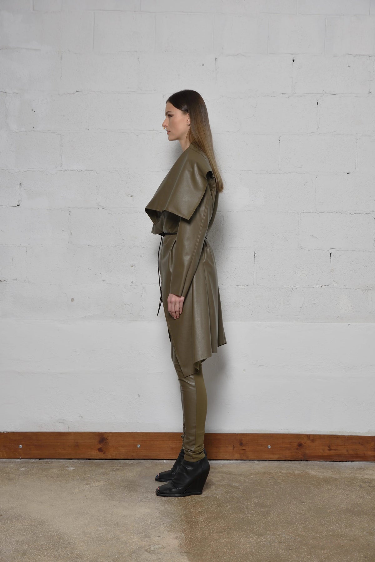Uneven coat from SIMPLY MILA Modern Women's Clothing featuring a stylish, textured design and a relaxed fit.