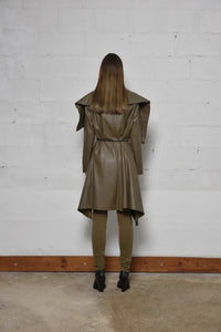 Simply Mila modern women's uneven coat in neutral fabric, displayed on a hanger with a textured, stylish design.