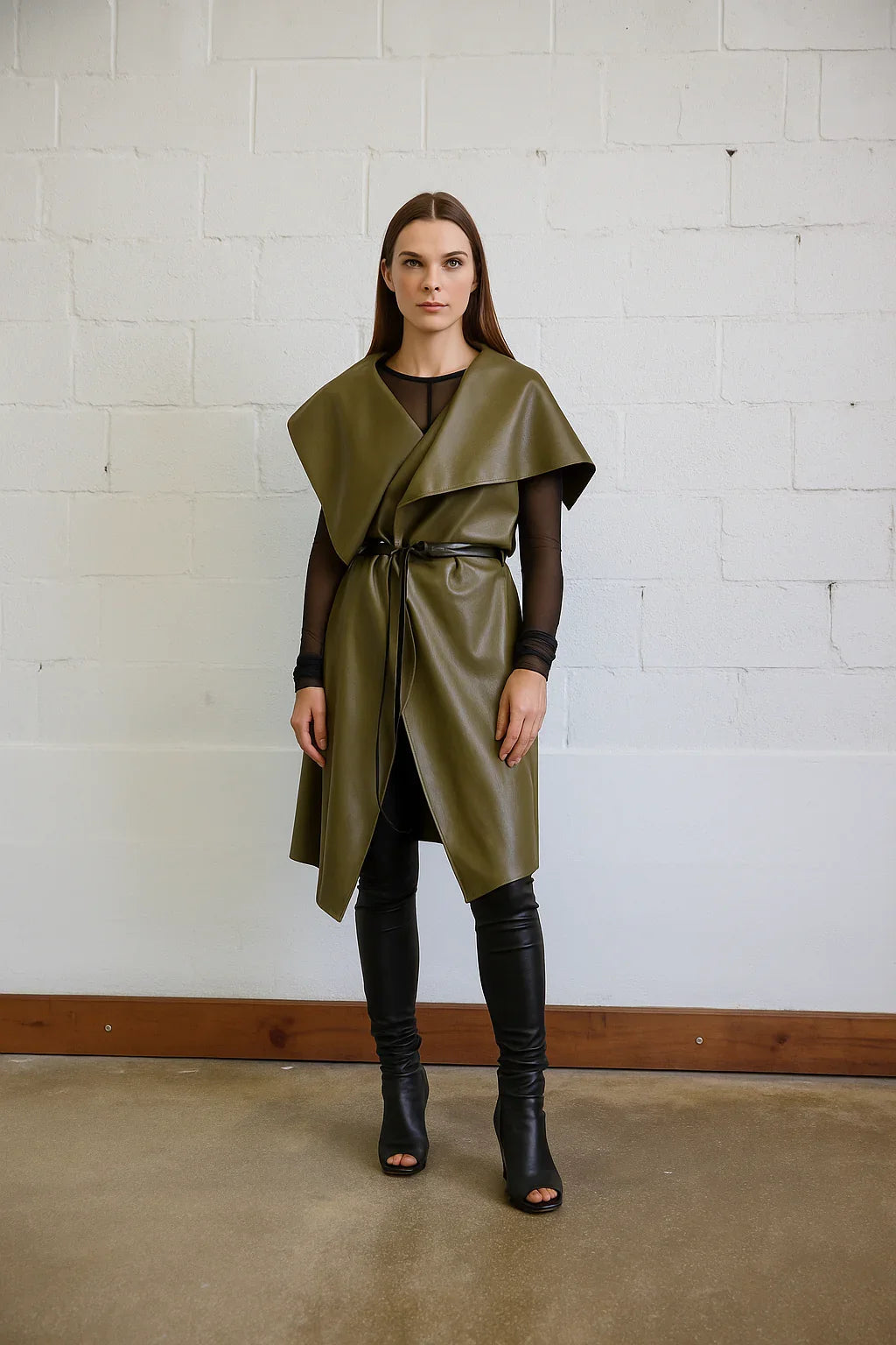 Uneven sleeveless coat by SIMPLY MILA, modern women's fashion, featuring a stylish, asymmetrical design and neutral color.