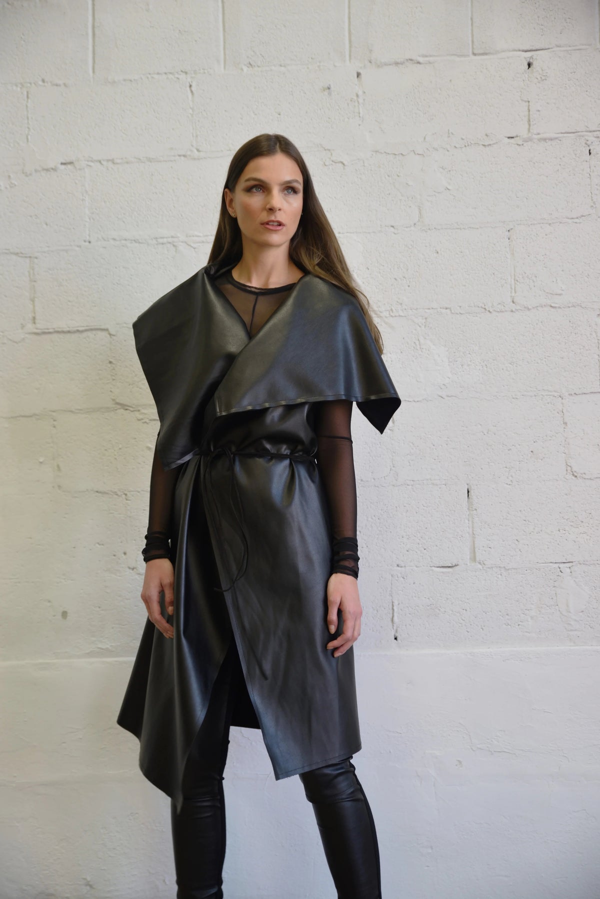 Uneven sleeveless coat by SIMPLY MILA featuring modern design, with a stylish asymmetric hem and tailored fit for women.