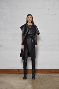 Uneven sleeveless coat by SIMPLY MILA, modern women's fashion, showcasing stylish asymmetric hem and tailored fit.