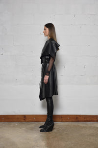 Uneven sleeveless coat by SIMPLY MILA, modern women's fashion, in a stylish, asymmetrical design with a neutral color.