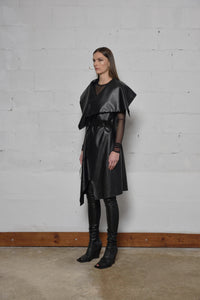 Uneven sleeveless coat by SIMPLY MILA, modern women's fashion, featuring a stylish cut and textured fabric in a contemporary design.