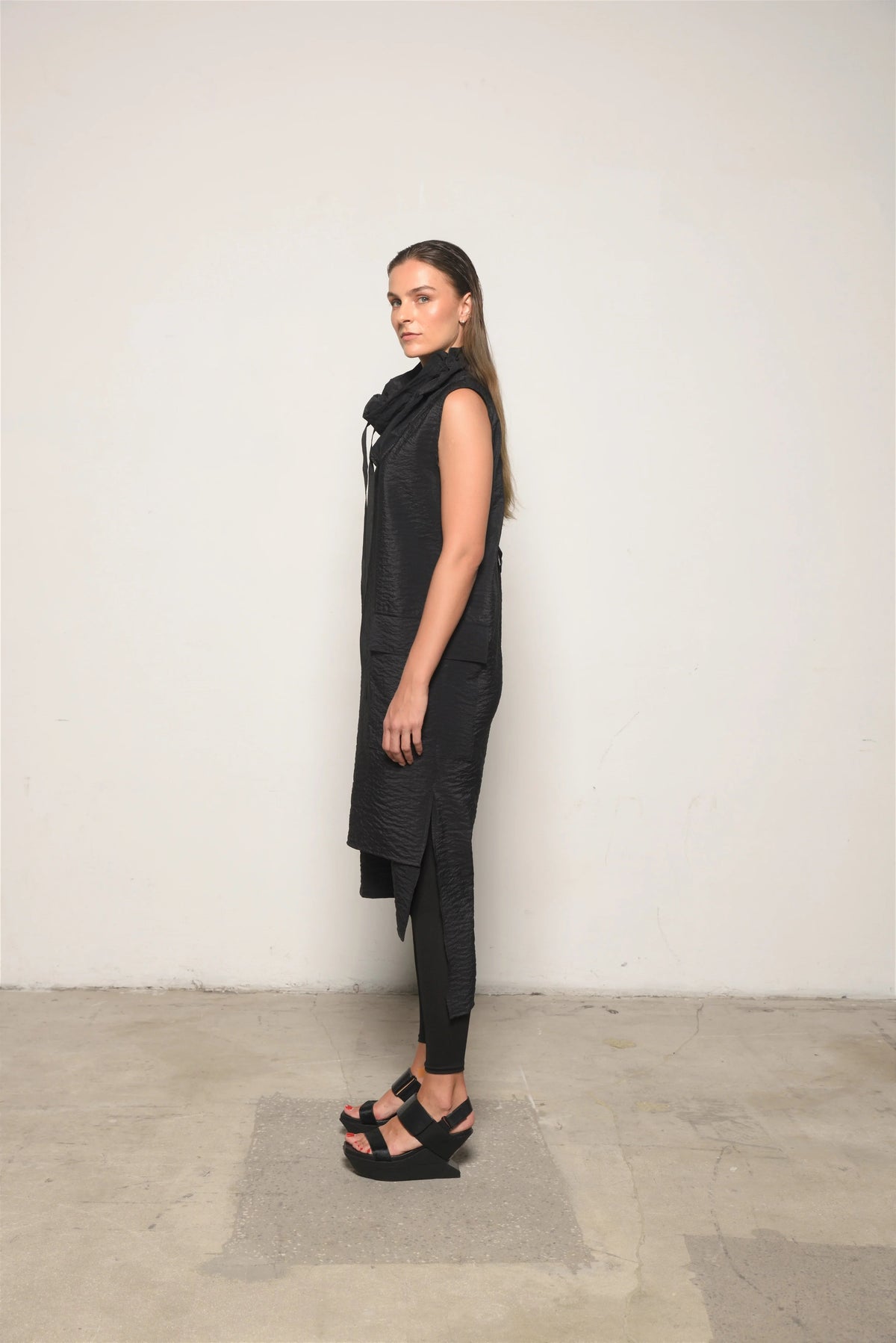 Elegant black Evolution Dress by SIMPLY MILA Modern Women's Clothing, showcasing a stylish, flowing dress on a model.