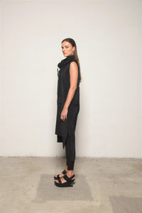 Elegant black Evolution Dress by SIMPLY MILA Modern Women's Clothing, showcasing a stylish, flowing dress on a model.