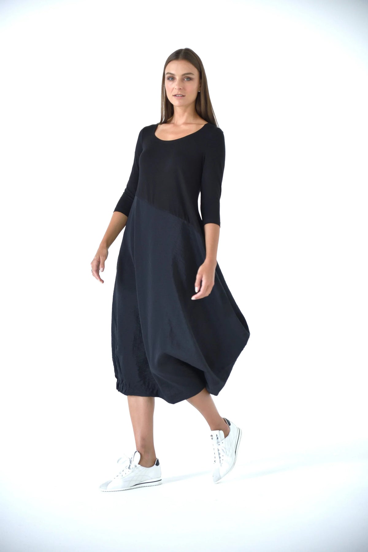 Elegant Babylon dress by SIMPLY MILA, featuring a flowing design suitable for modern women's fashion, shown in the image.
