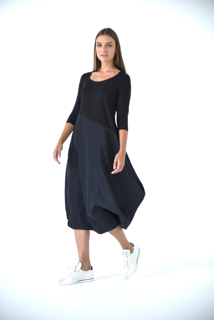Elegant Babylon dress by SIMPLY MILA, featuring a flowing design suitable for modern women's fashion, shown in the image.