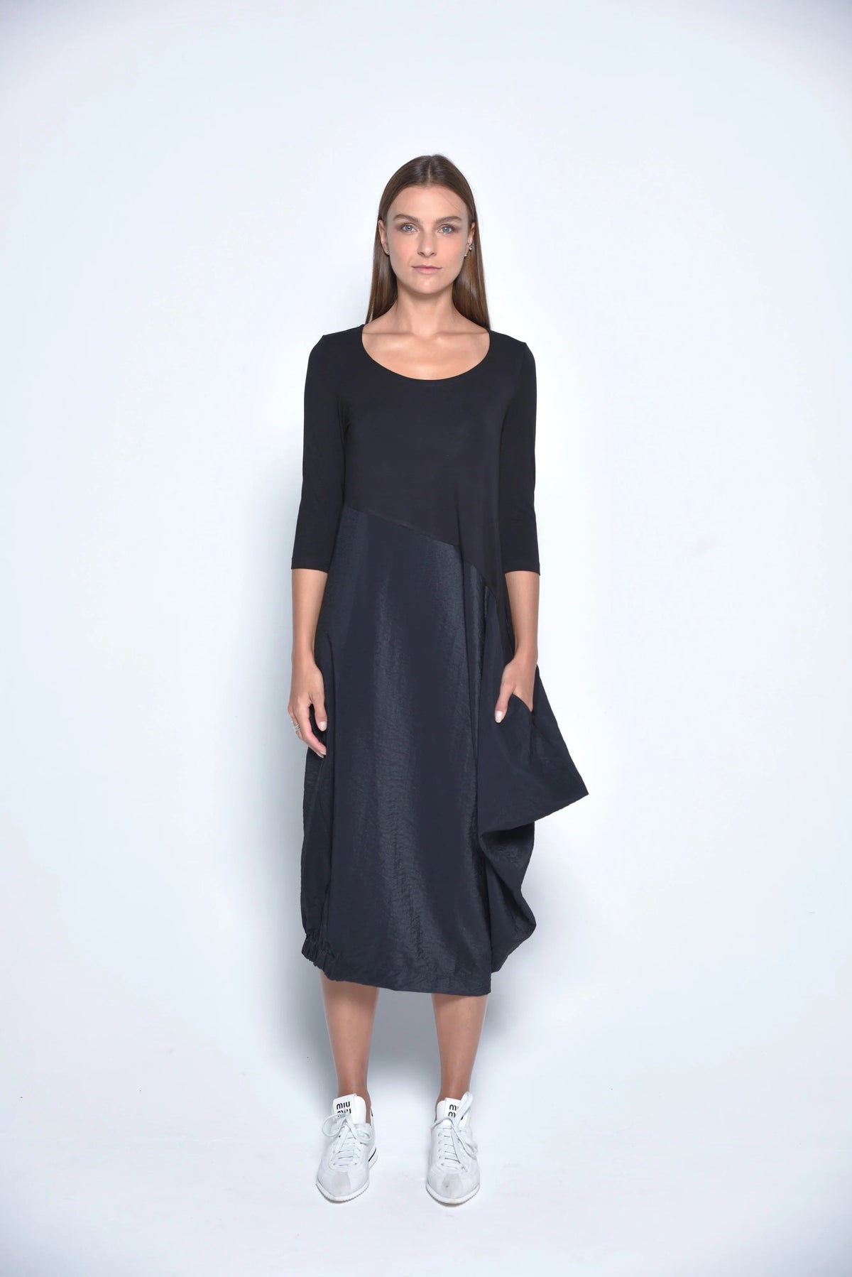 Simply Mila Babylon Dress, modern women's dress with flowing fabric and stylish design, shown on a model.