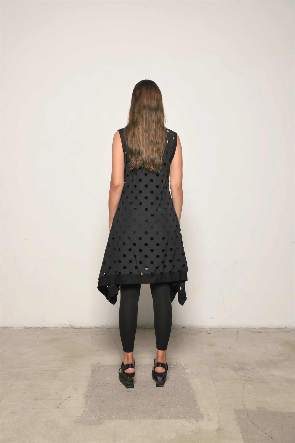 Perforated tunic dress from SIMPLY MILA Modern Women's Clothing, featuring a stylish, breathable design and relaxed fit.