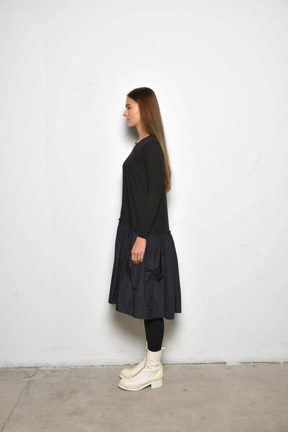 Side view of a stylish Dune dress by SIMPLY MILA Modern Women's Clothing, featuring a flattering fit and contemporary design.