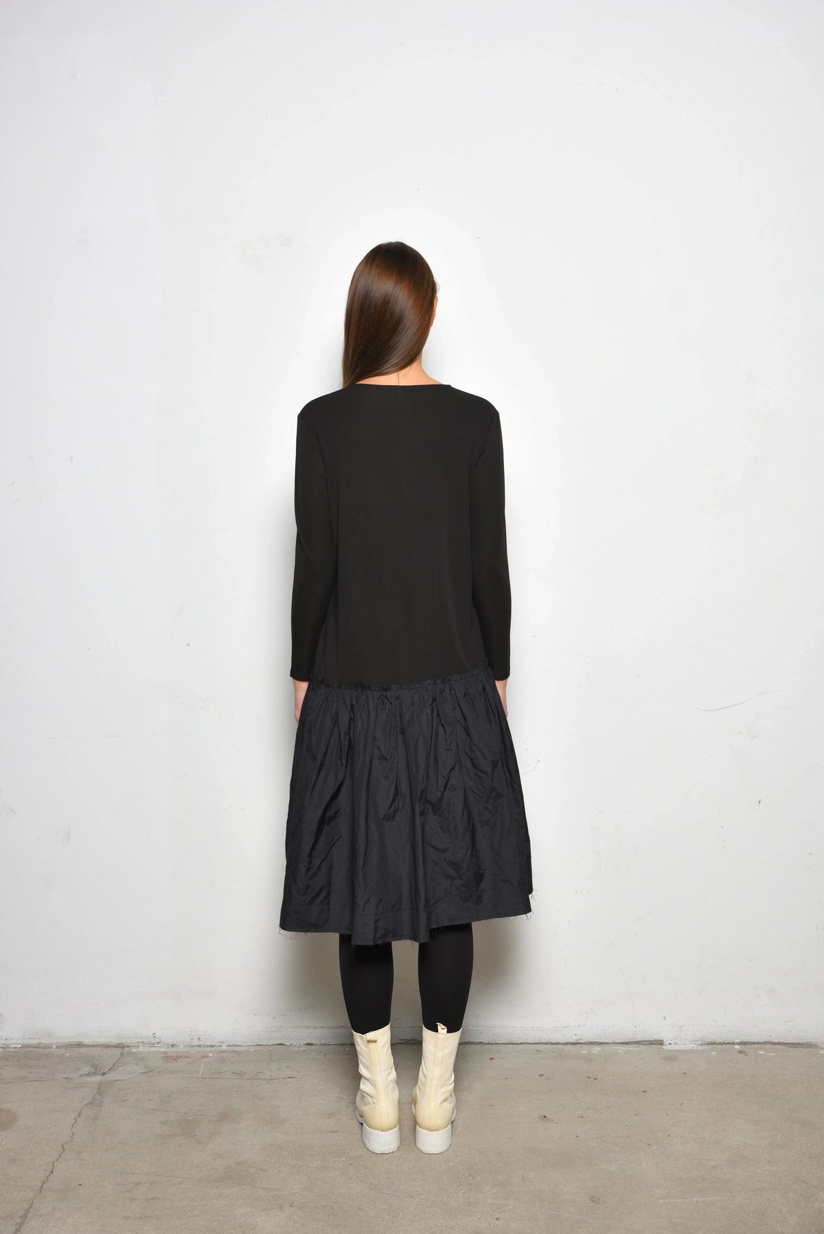 Back view of a stylish Dune dress by SIMPLY MILA Modern Women's Clothing, featuring a flowing design and elegant silhouette.