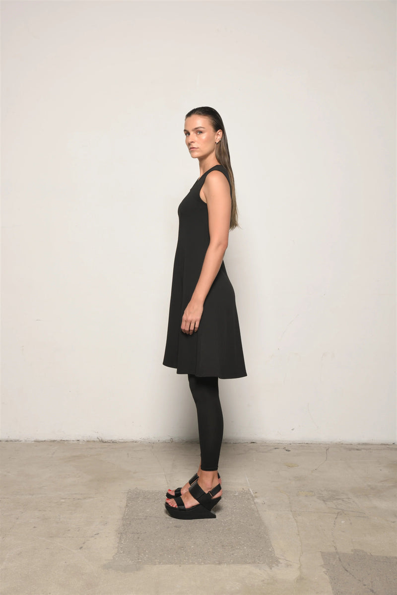 Sleeveless Traveler Dress by SIMPLY MILA, lightweight casual dress for women, shown in a natural pose with neutral background.