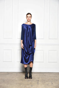 Front view of a midnight-colored draped dress by SIMPLY MILA Modern Women's Clothing, showcasing elegant fabric and stylish design.