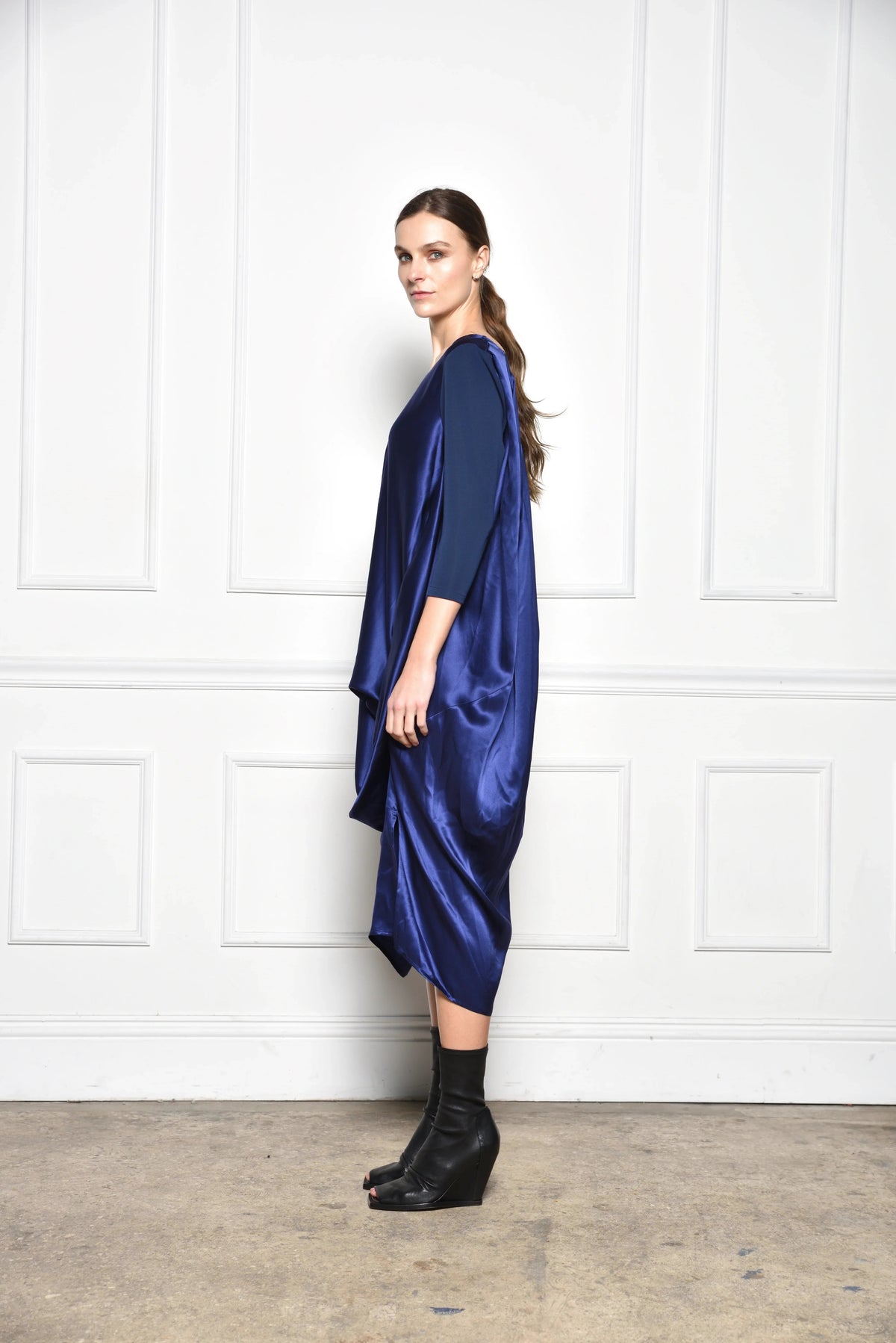 Midnight draped dress from SIMPLY MILA Modern Women's Clothing, featuring flowing fabric and elegant silhouette.