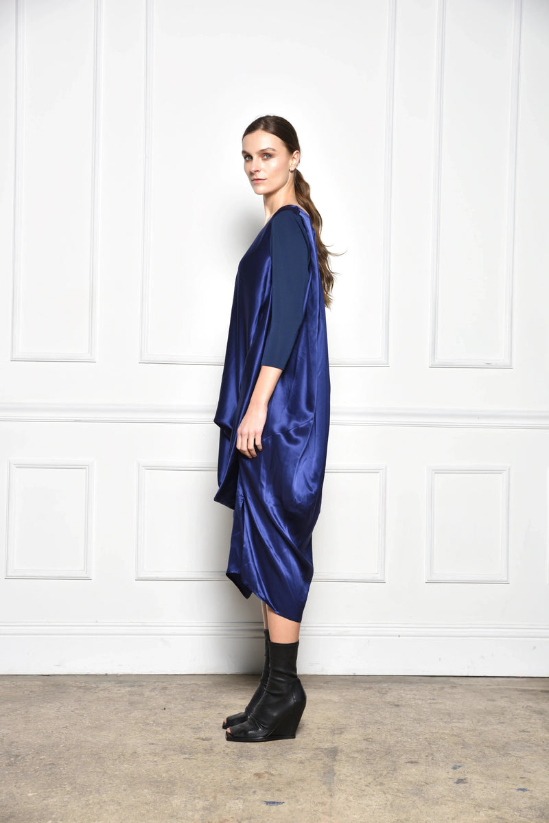 Midnight draped dress from SIMPLY MILA Modern Women's Clothing, featuring flowing fabric and elegant silhouette.