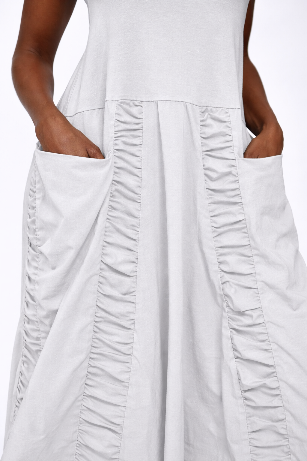 Close-up of the sleeveless Ophelia Dress by SIMPLY MILA, showcasing the fabric and stylish design details.