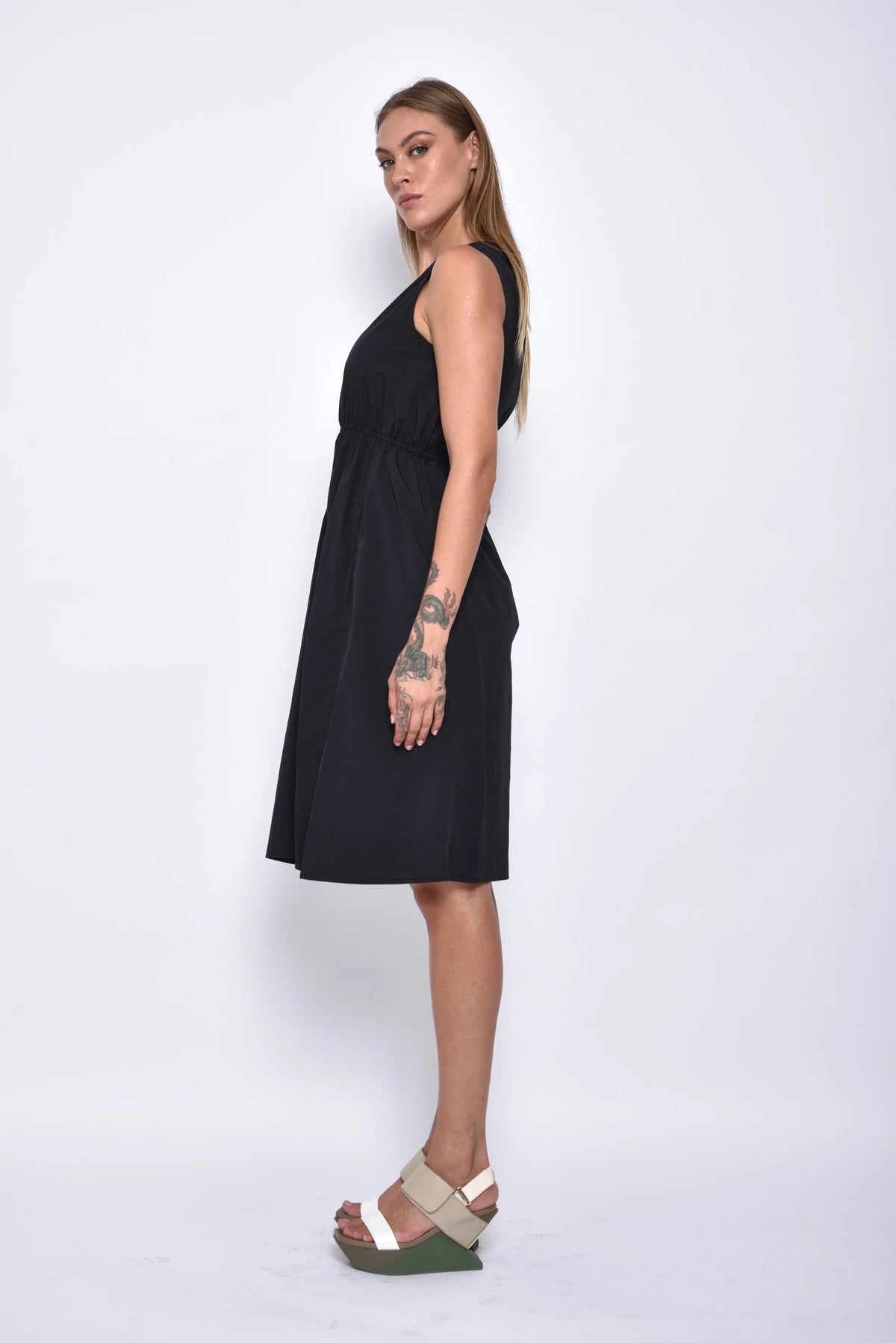 Side view of the Helena Dress by SIMPLY MILA Modern Women's Clothing, showcasing its stylish design and fit.