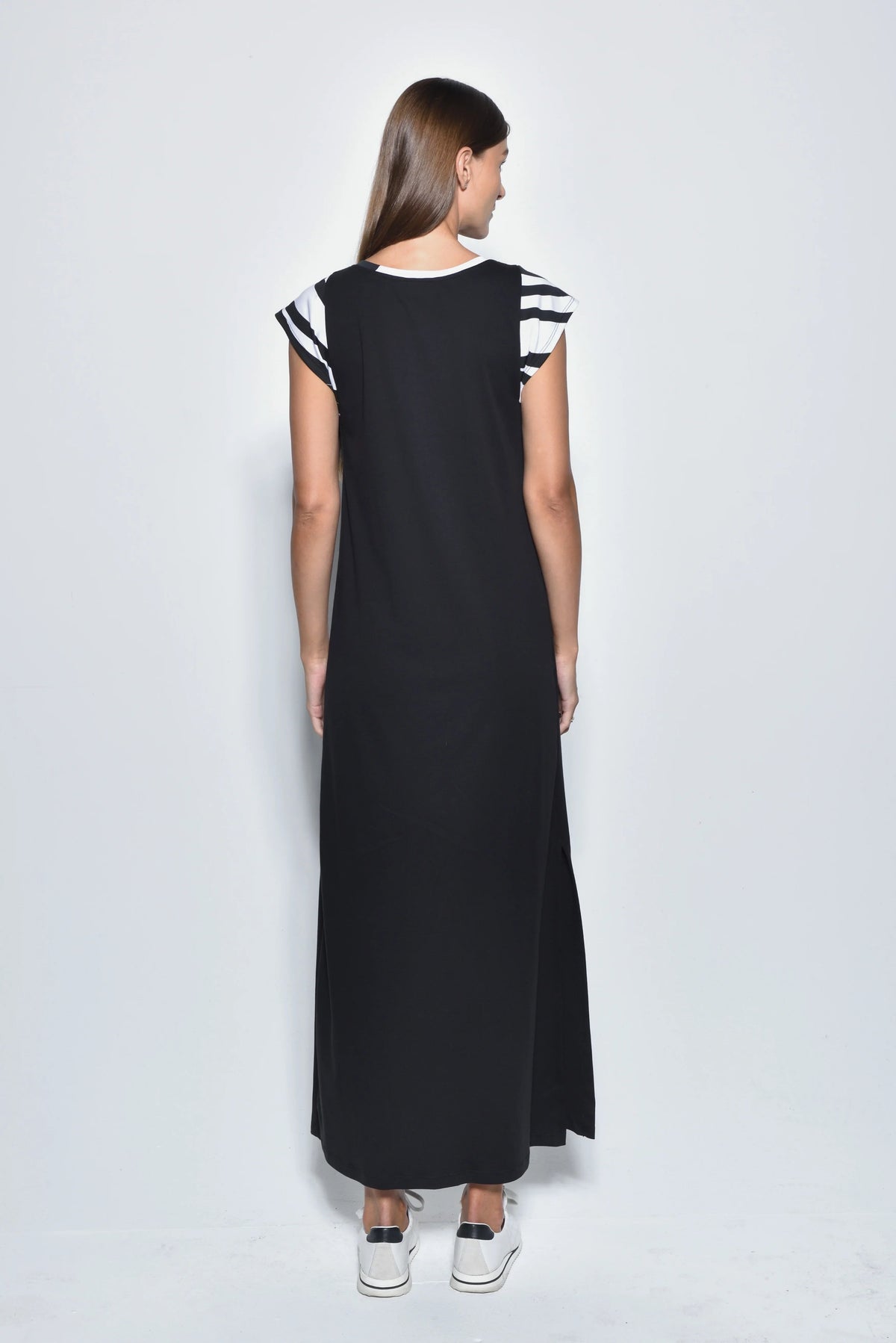 Back view of a stylish Phoebe dress by SIMPLY MILA Modern Women's Clothing, featuring a fitted silhouette and elegant design.