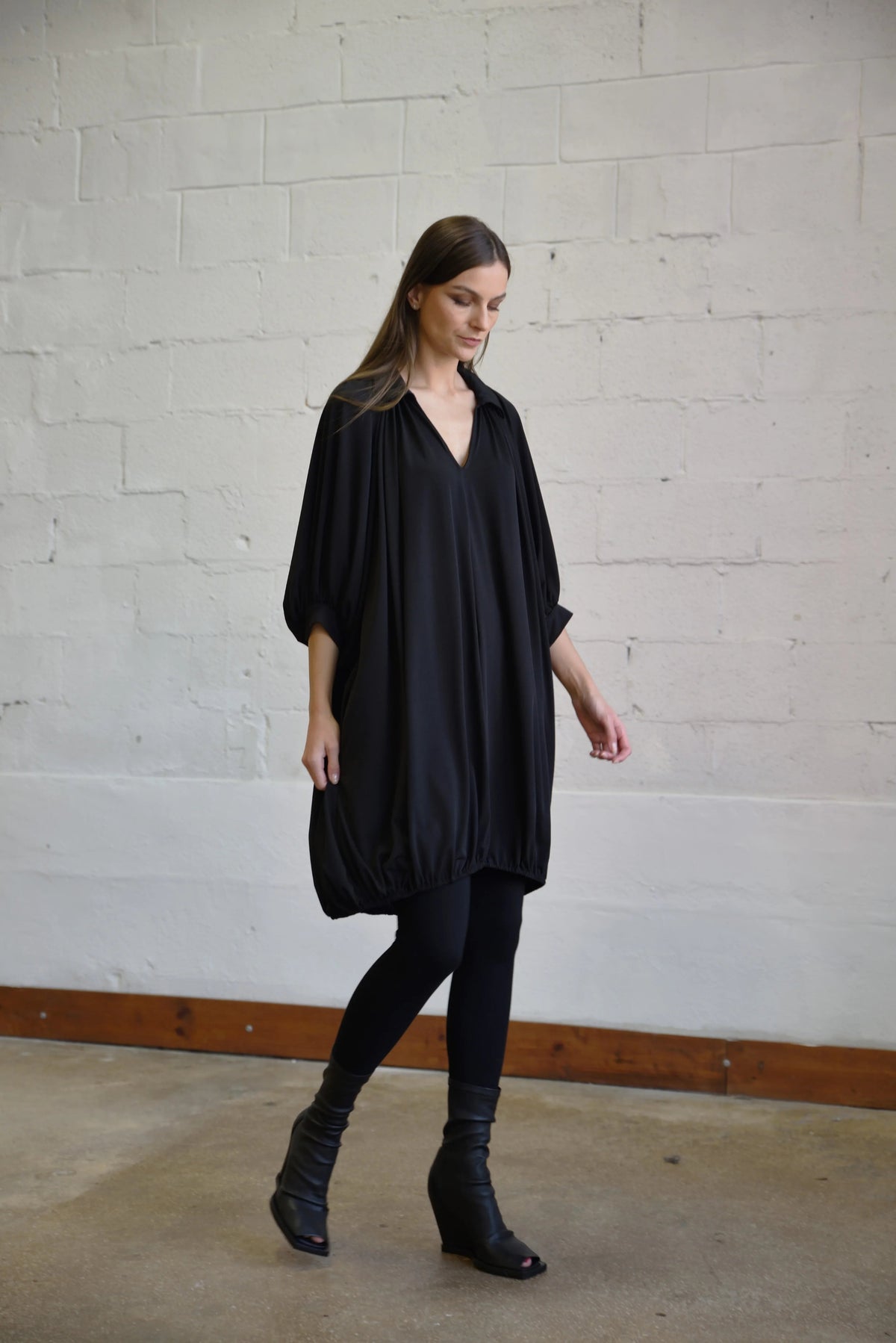 Elegant Poetry Dress by SIMPLY MILA, showcasing a stylish modern women's dress with a flowy silhouette and intricate fabric details.
